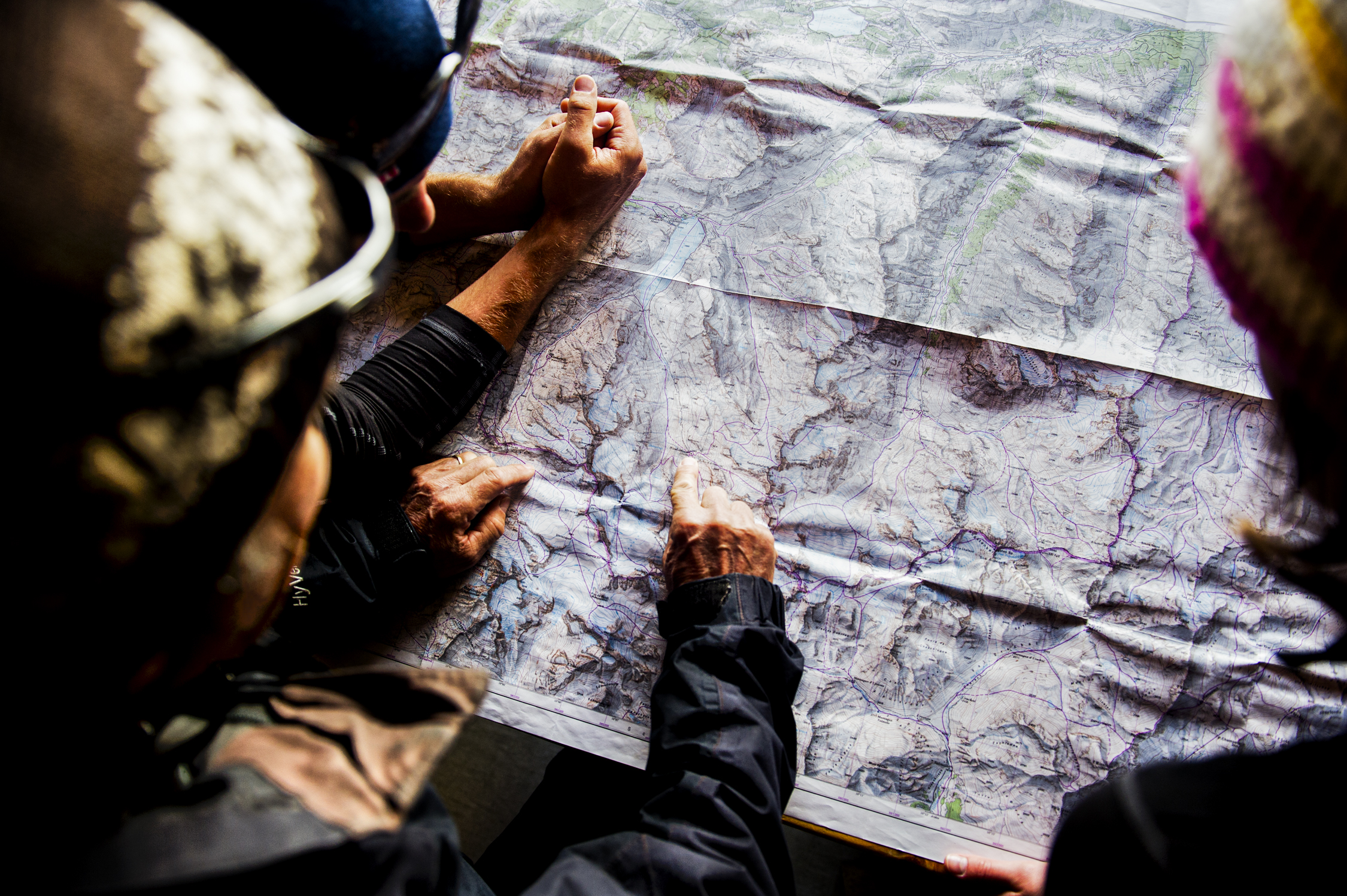 Outdoor guides holding a map